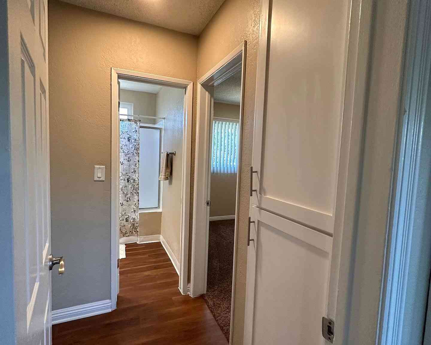 apartment hallway with built in linen storage