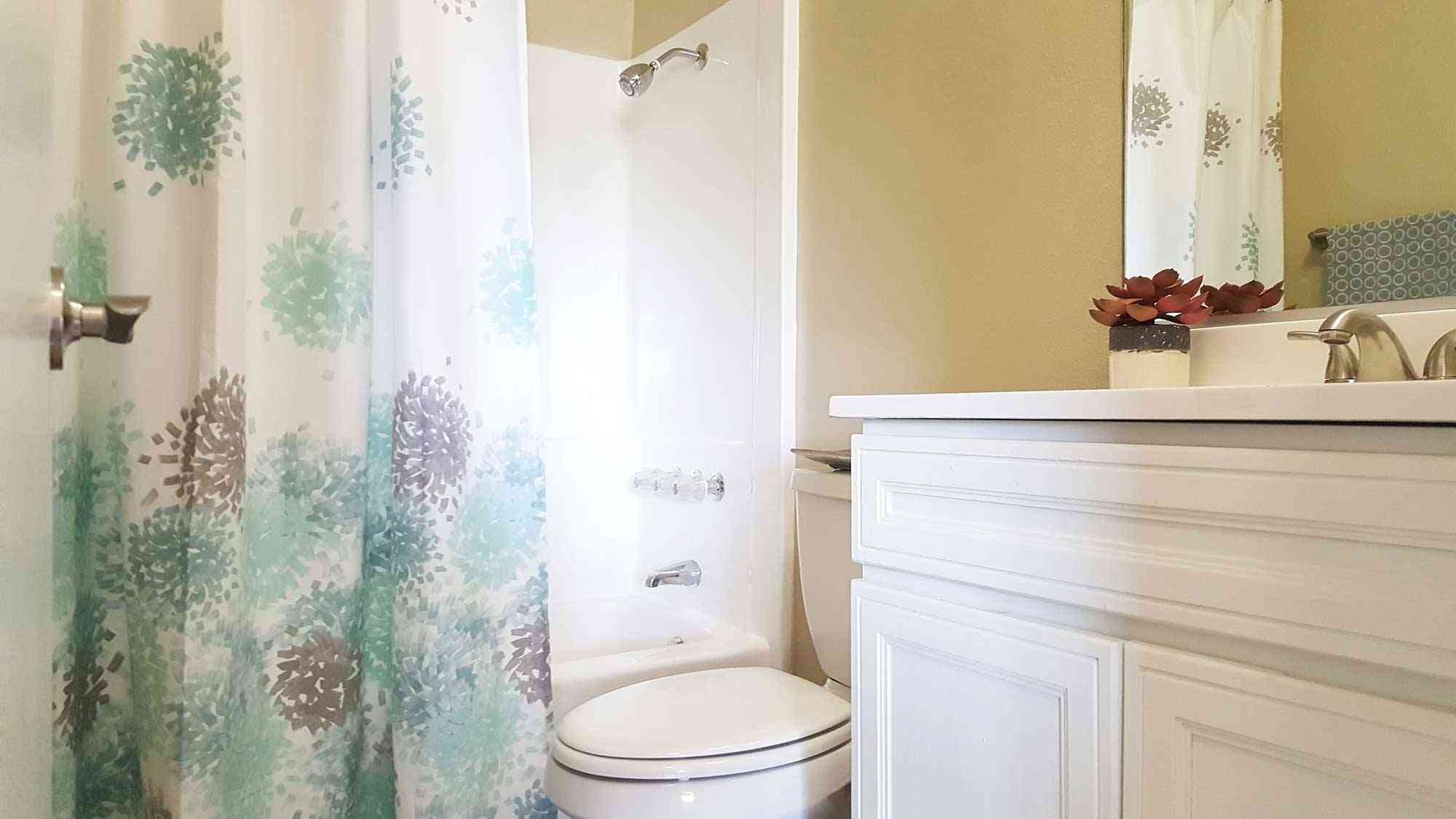 clean bathroom with full sized soaking tub